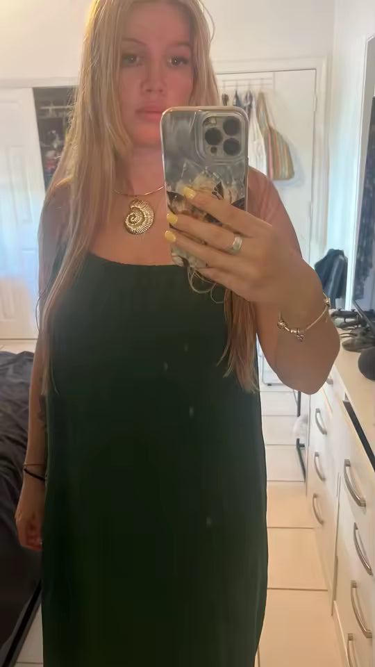 Customer wearing the backless dress at home