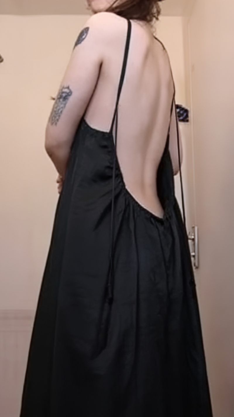 Customer wearing the backless dress at home
